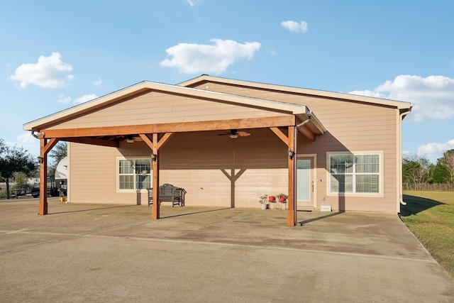 view of car parking featuring ceiling fan