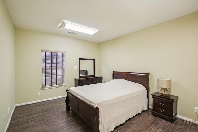 bedroom featuring dark wood-type flooring