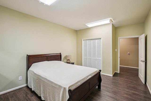 bedroom featuring dark hardwood / wood-style flooring and a closet