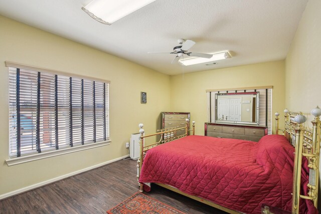 bedroom featuring ceiling fan and dark hardwood / wood-style floors