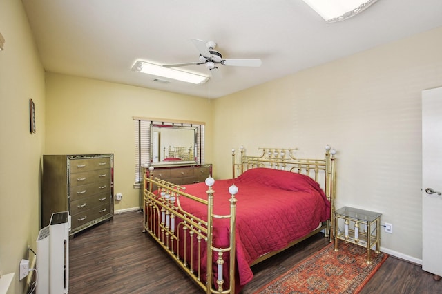 bedroom with ceiling fan and dark hardwood / wood-style flooring