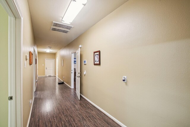 hall featuring dark hardwood / wood-style floors