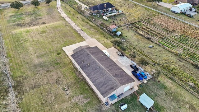 birds eye view of property featuring a rural view