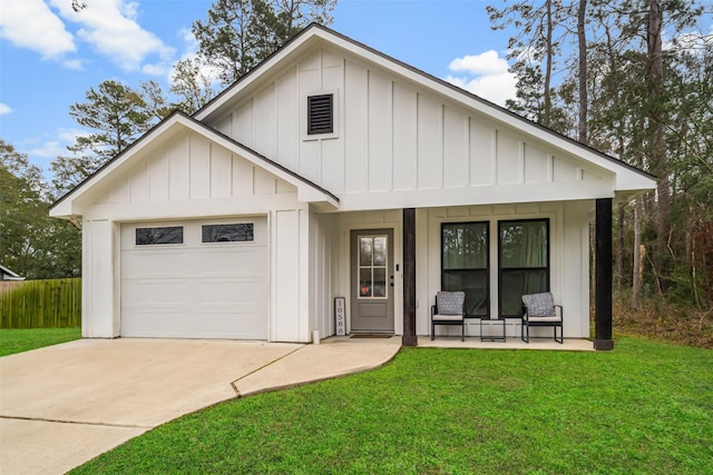 modern inspired farmhouse featuring covered porch, a front lawn, and a garage