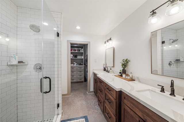 bathroom featuring vanity and a shower with shower door