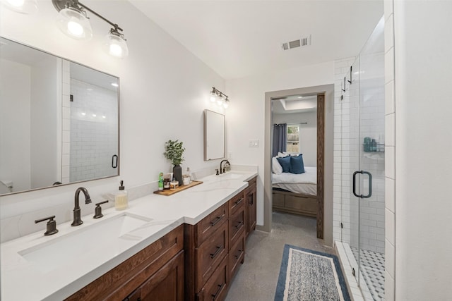 bathroom with walk in shower and vanity