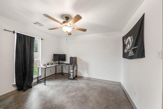 office area with ceiling fan and concrete floors