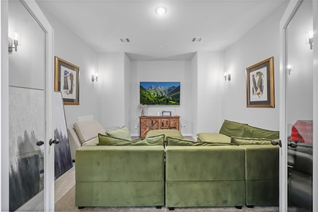 living room featuring french doors and carpet flooring