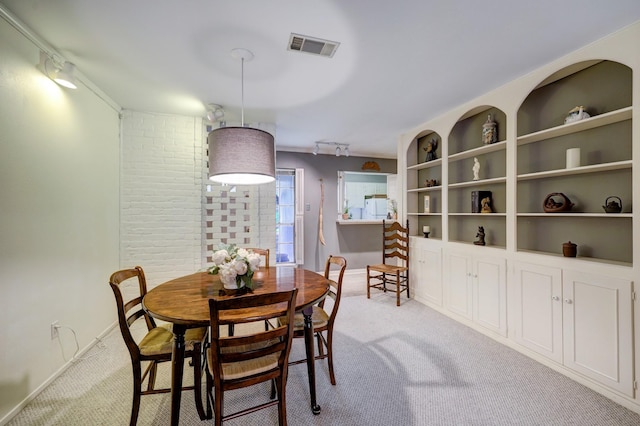 carpeted dining area with built in features