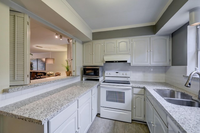 kitchen featuring extractor fan, decorative backsplash, white electric stove, white cabinetry, and sink