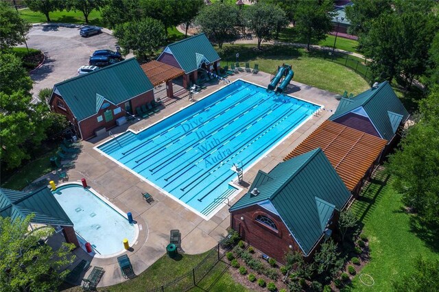 view of pool with a yard and a patio