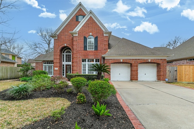 traditional home with concrete driveway, brick siding, and an attached garage