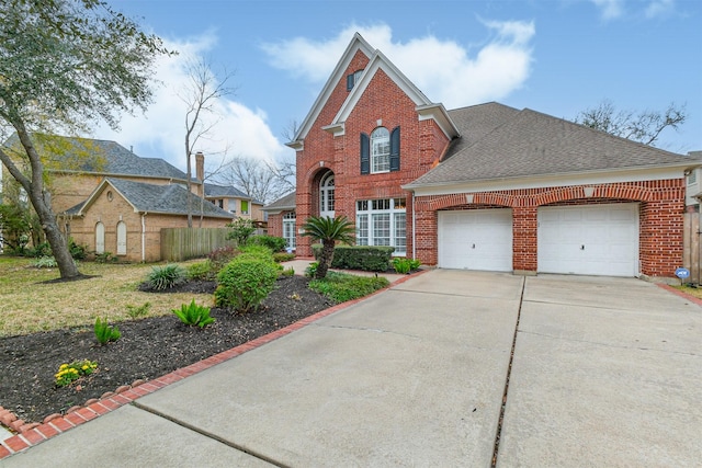 traditional-style house with a garage, concrete driveway, brick siding, and a shingled roof