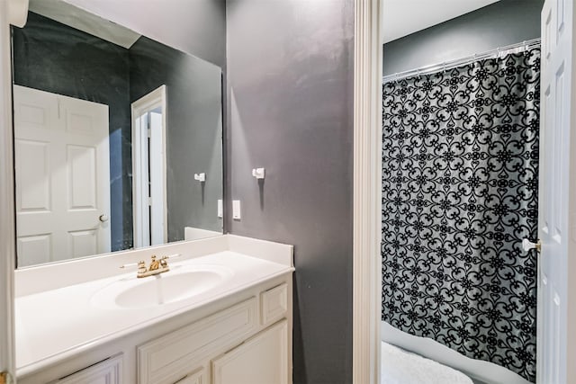 full bathroom with curtained shower and vanity