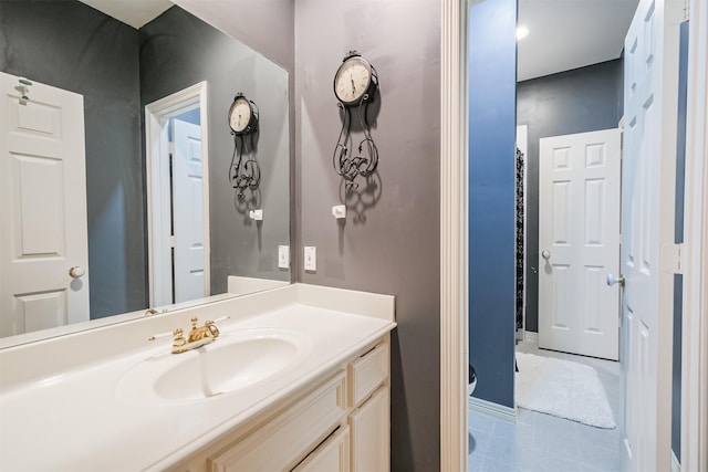 bathroom featuring tile patterned flooring and vanity