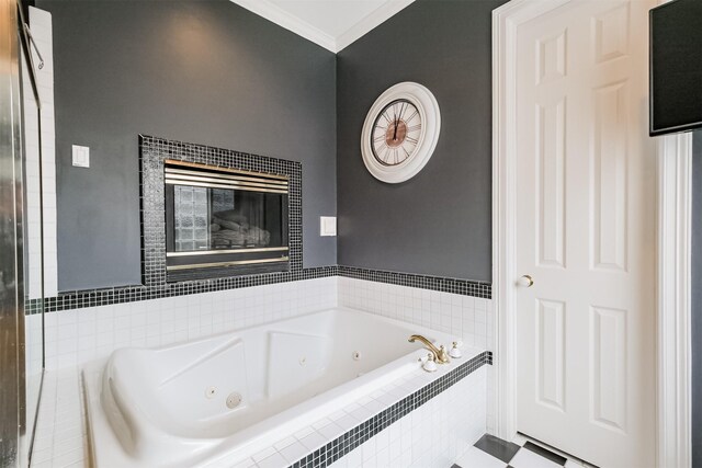 bathroom with ornamental molding, tiled bath, and a fireplace