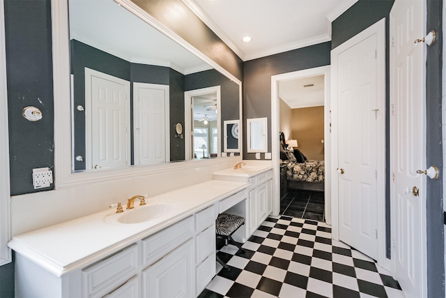 bathroom featuring crown molding, double vanity, ensuite bathroom, a sink, and tile patterned floors