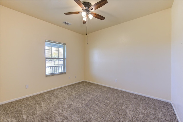 unfurnished room with ceiling fan and carpet flooring