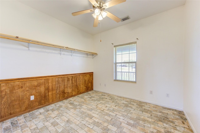 spare room with ceiling fan