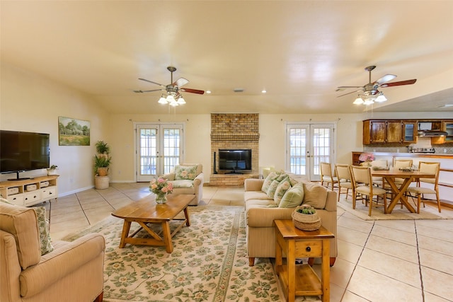 tiled living room featuring french doors, lofted ceiling, and plenty of natural light