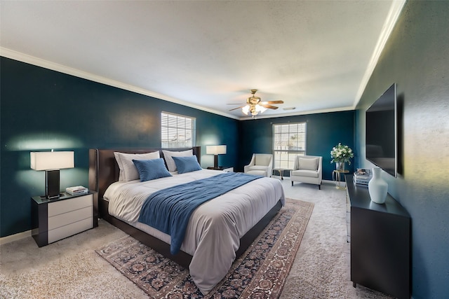 bedroom featuring ornamental molding, ceiling fan, and carpet flooring