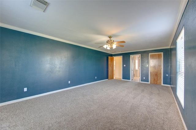 unfurnished bedroom with ceiling fan, carpet, and crown molding