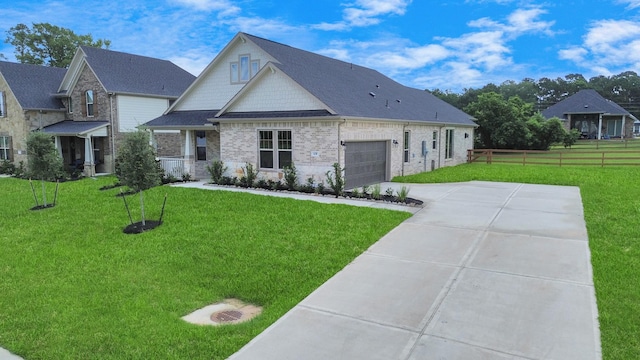 view of front facade featuring a front lawn and a garage