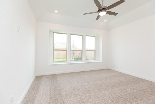 spare room featuring ceiling fan, lofted ceiling, recessed lighting, light carpet, and baseboards