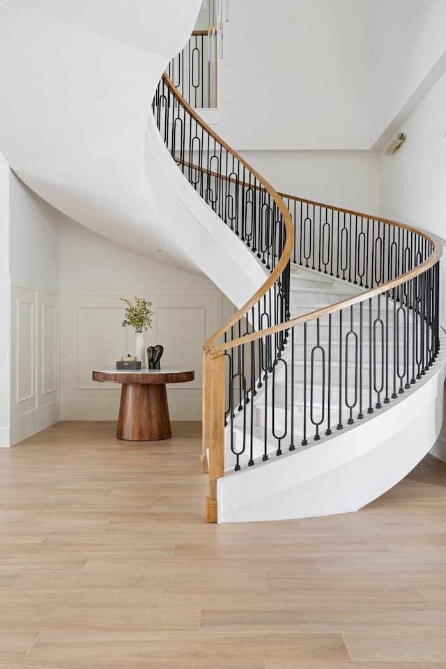 stairs featuring hardwood / wood-style floors