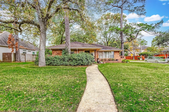 single story home with a front lawn