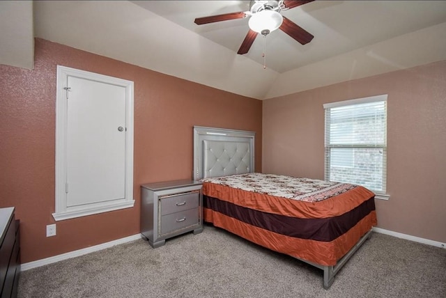 carpeted bedroom with lofted ceiling and ceiling fan