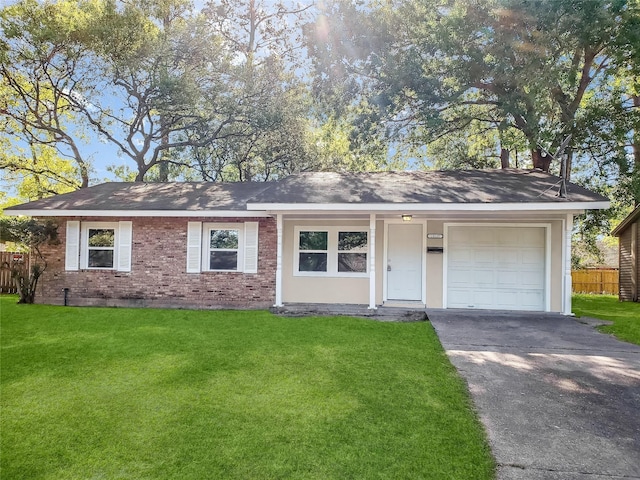 ranch-style house with a garage and a front lawn