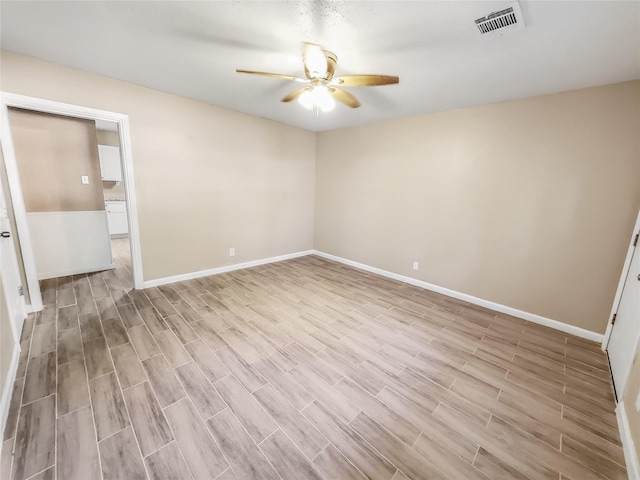 empty room with light hardwood / wood-style floors and ceiling fan