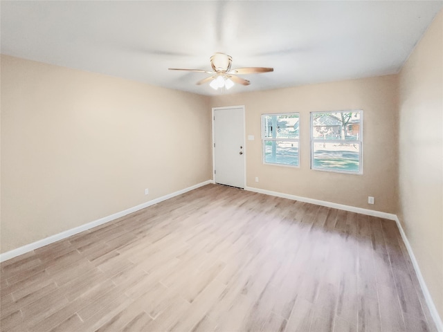 unfurnished room with ceiling fan and light hardwood / wood-style flooring