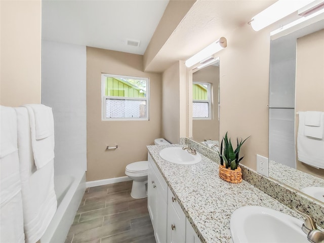 bathroom with toilet and vanity