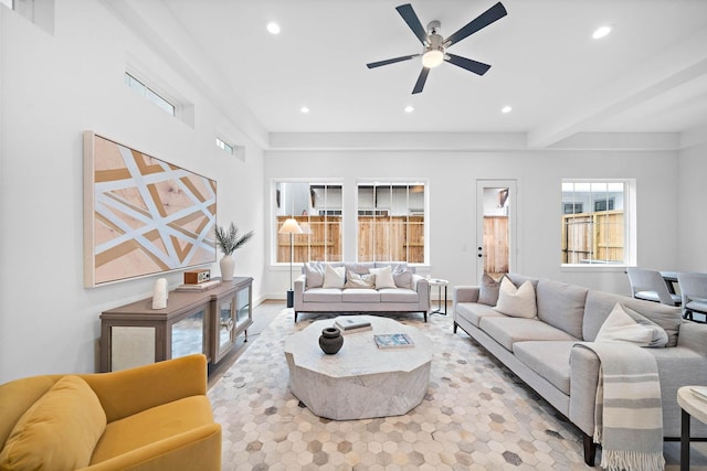 living room with beam ceiling and ceiling fan