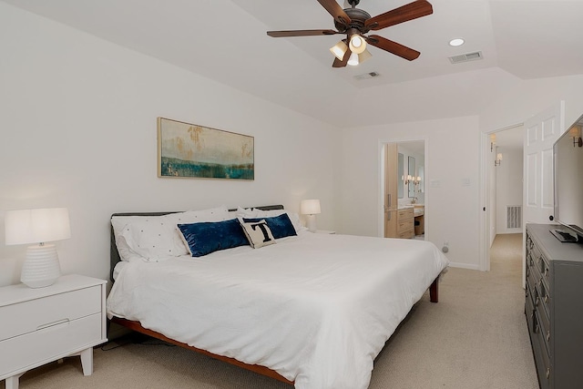 carpeted bedroom with ceiling fan, connected bathroom, and lofted ceiling