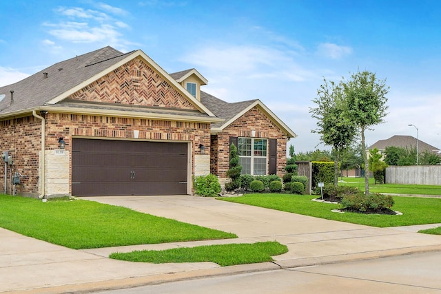 craftsman house featuring a front yard and a garage