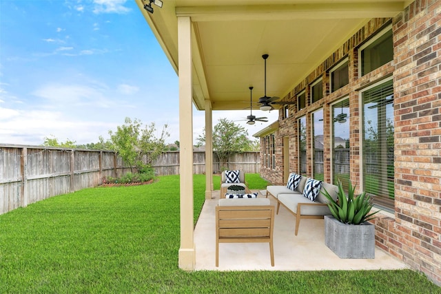 view of yard featuring a patio, ceiling fan, and outdoor lounge area