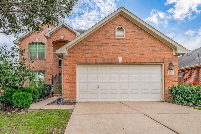 front of property with a garage