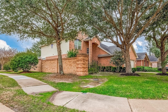 view of home's exterior with a lawn and a garage