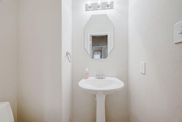 bathroom featuring toilet