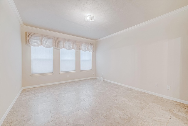 empty room featuring ornamental molding and a textured ceiling