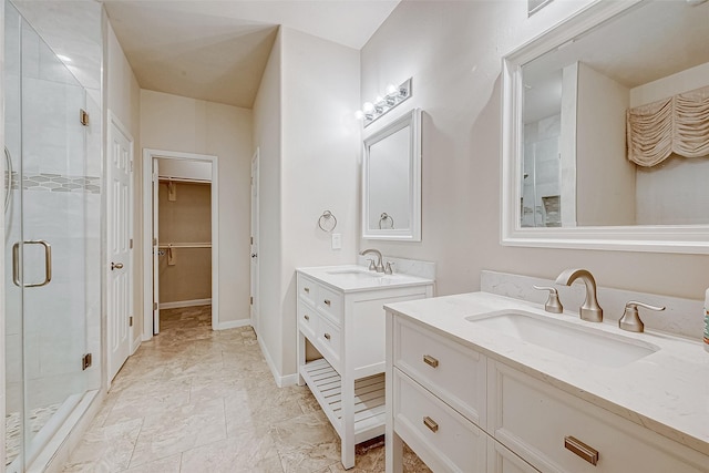 bathroom with an enclosed shower and vanity