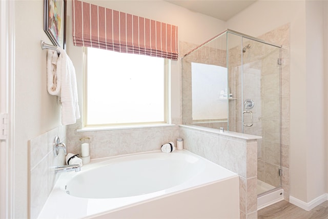 bathroom with plus walk in shower and wood-type flooring