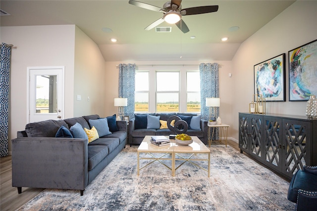 living room featuring ceiling fan, vaulted ceiling, and hardwood / wood-style floors