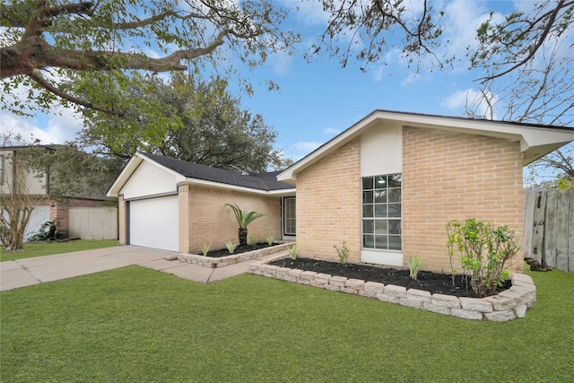 ranch-style house featuring a front lawn and a garage