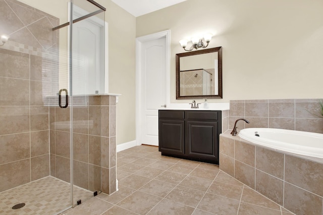 bathroom featuring vanity, tile patterned flooring, and separate shower and tub