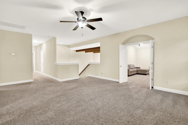 carpeted spare room with ceiling fan