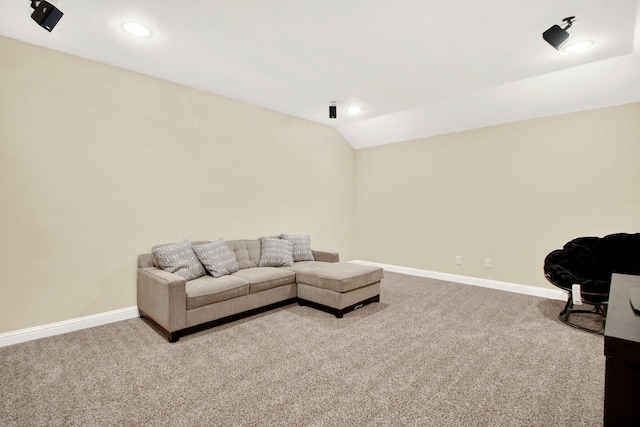 living room featuring lofted ceiling and light colored carpet